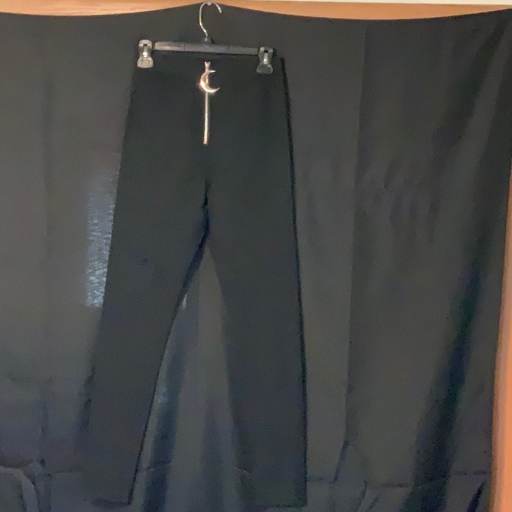 Pants with moon ornament